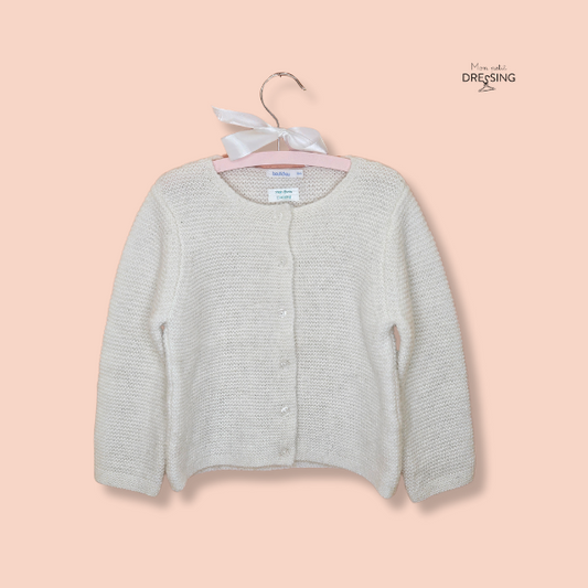 Cardigan blanc en laine de la marque boutchou. Bouton blanc