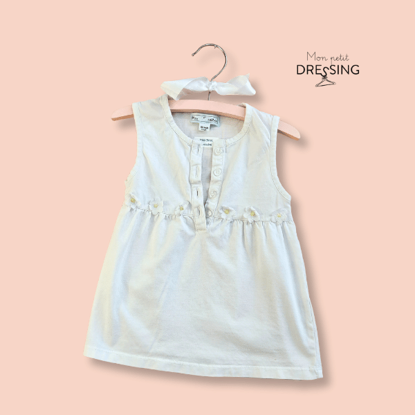 Mon Petit Dressing | Blouse blanche a fleurs sans manche. encolure ouverture sur 4 boutons.